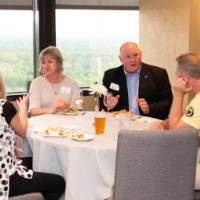 5 people at table networking